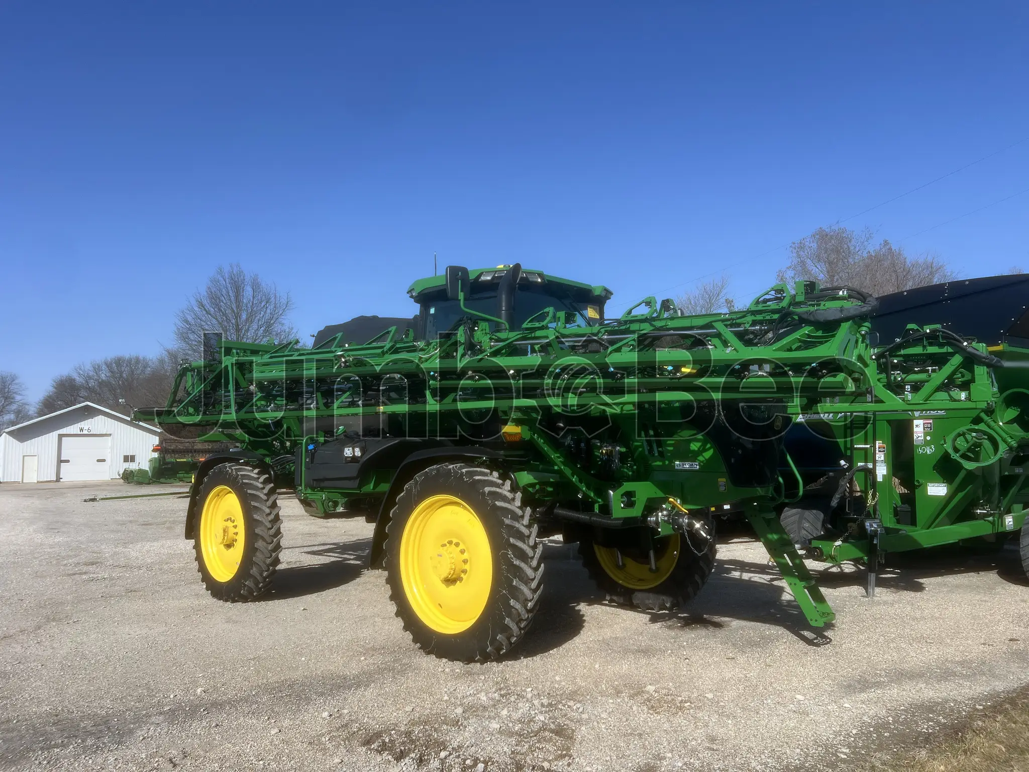 John Deere 412R 2024 - Usado (716 Horas) en Venta — foto 1 de 22